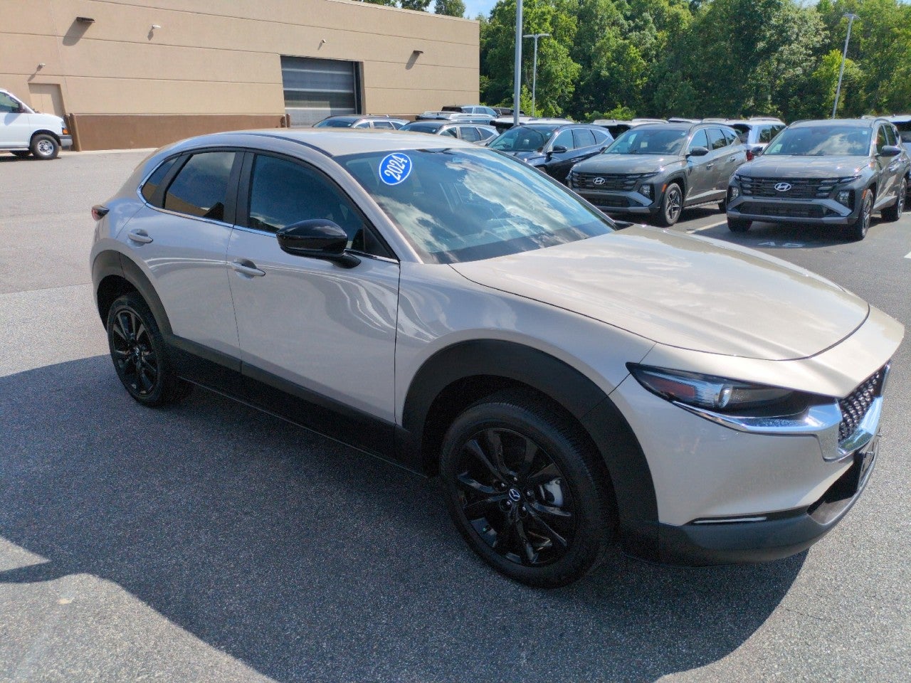 2024 Mazda Mazda CX-30 2.5 S Select Sport in Tan — front three-quarter view