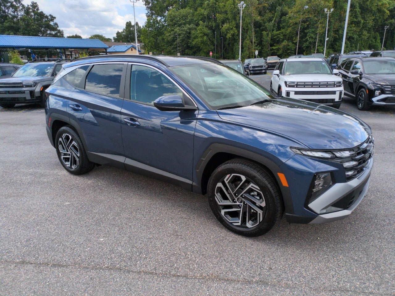 2026 Hyundai TUCSON SEL Plus FWD in Blue — front three-quarter view